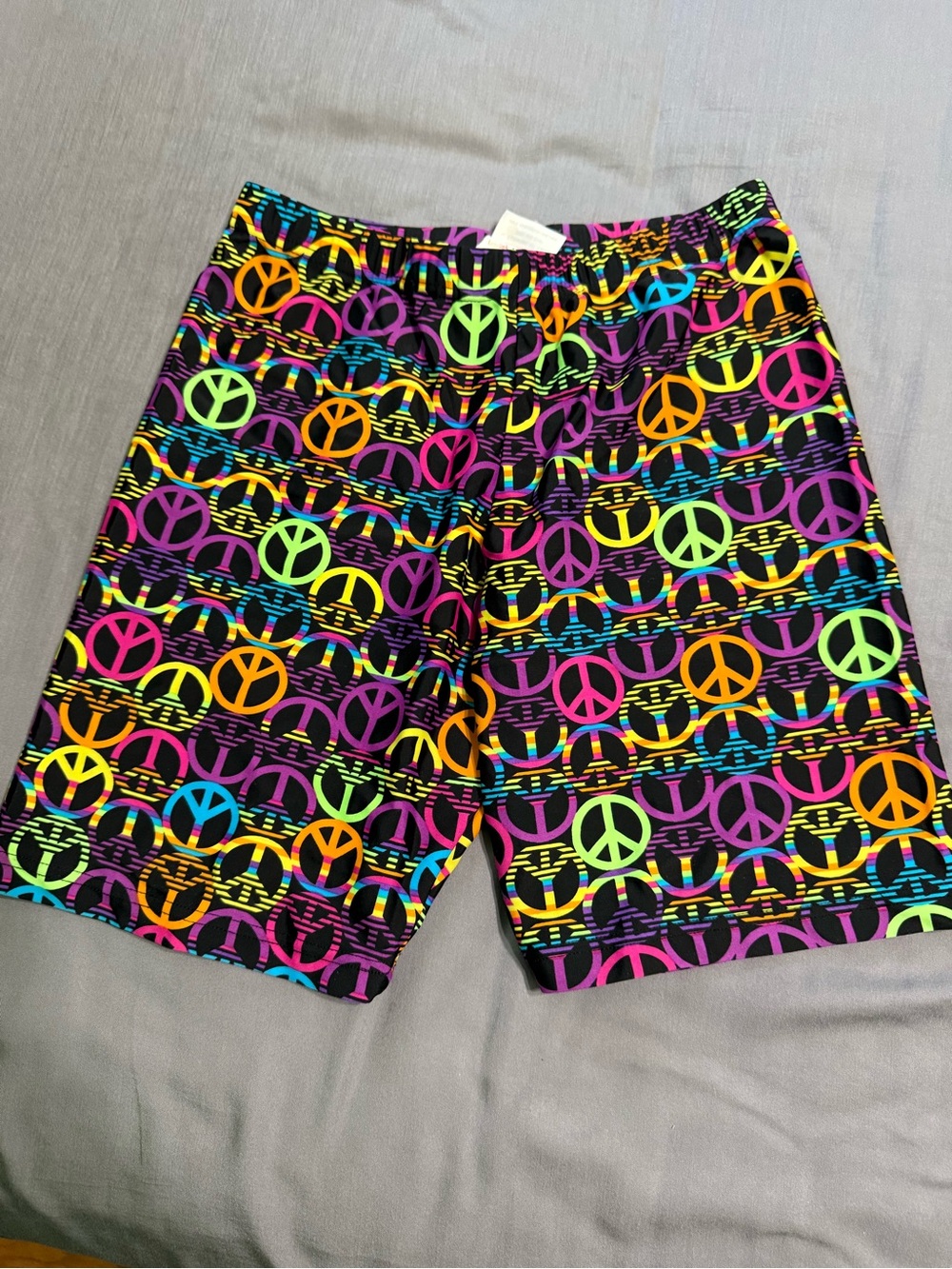Women’s spandex with Neon Peace Sign Print